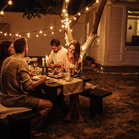 Friends enjoying dinner together outside